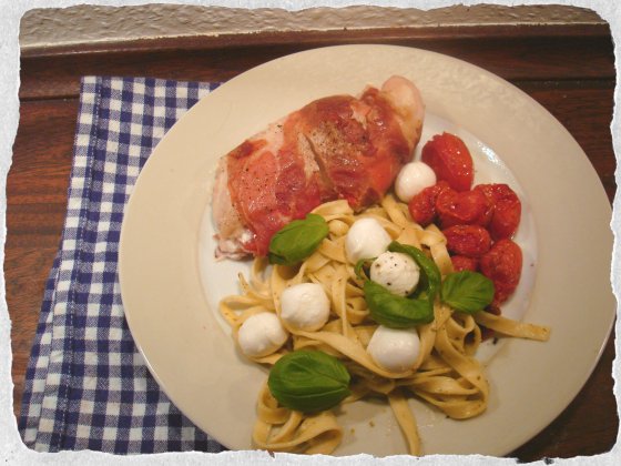 Stuffed chicken breast, pesto pasta and roasted tomatoes